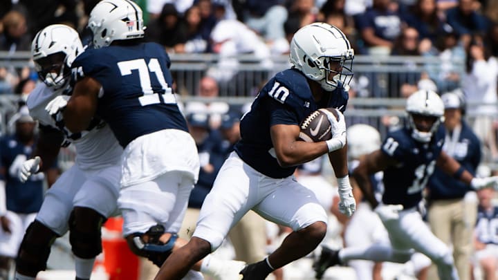Penn State running back Nick Singleton carries the ball during the Blue-White Game at Beaver Stadium. Penn State running back Nick Singleton carries the ball during the Blue-White Game at Beaver Stadium.