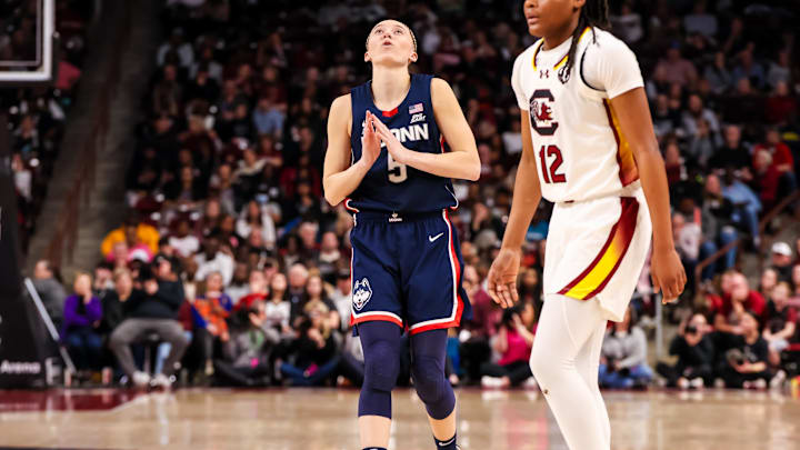 Feb 16, 2025; Columbia, South Carolina, USA; UConn Huskies guard Paige Bueckers (5) reacts after making a three point basket against the South Carolina Gamecocks in the second half at Colonial Life Arena. Mandatory Credit: Jeff Blake-Imagn Images