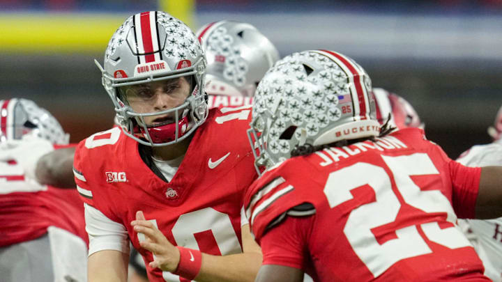 Ohio State Buckeyes quarterback Julian Sayin (10) looks to hand the ball off to Ohio State Buckeyes running back Bo Jackson (25) on Saturday, Dec. 6, 2025, during the Big Ten football championship at Lucas Oil Stadium in Indianapolis. Ohio State Buckeyes quarterback Julian Sayin (10) looks to hand the ball off to Ohio State Buckeyes running back Bo Jackson (25) on Saturday, Dec. 6, 2025, during the Big Ten football championship at Lucas Oil Stadium in Indianapolis.