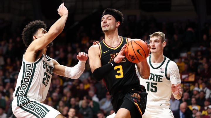 Feb 6, 2024; Minneapolis, Minnesota, USA; Minnesota Golden Gophers forward Dawson Garcia (3) works around Michigan State Spartans forward Malik Hall (25) and center Carson Cooper (15) during the first half at Williams Arena. Mandatory Credit: Matt Krohn-USA TODAY Sports