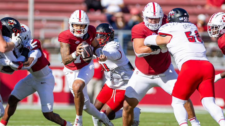 Nov 16, 2024; Stanford, California, USA; Stanford Cardinal quarterback Ashton Daniels (14) is chased down from behind during the first quarter against the Louisville Cardinals at Stanford Stadium. Mandatory Credit: Bob Kupbens-Imagn Images Nov 16, 2024; Stanford, California, USA; Stanford Cardinal quarterback Ashton Daniels (14) is chased down from behind during the first quarter against the Louisville Cardinals at Stanford Stadium. Mandatory Credit: Bob Kupbens-Imagn Images