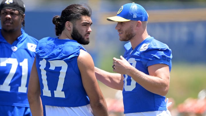 May 28, 2024; Thousand Oaks, CA, USA; Los Angeles Rams wide receiver Puka Nacua (17) and wide receiver Cooper Kupp (10) talk during OTAs at California Lutheran University. Mandatory Credit: Jayne Kamin-Oncea-USA TODAY Sports