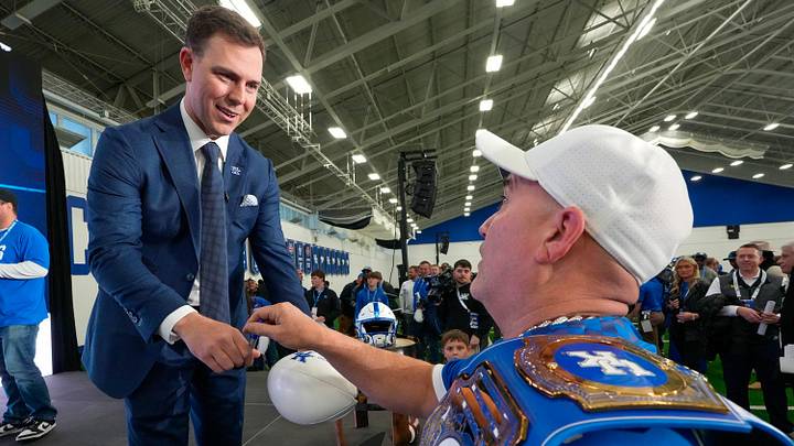 New Kentucky Wildcat football coach Will Stein signs a ball for Barry Cochran, from Bath County on Wednesday, December 3, 2025 New Kentucky Wildcat football coach Will Stein signs a ball for Barry Cochran, from Bath County on Wednesday, December 3, 2025