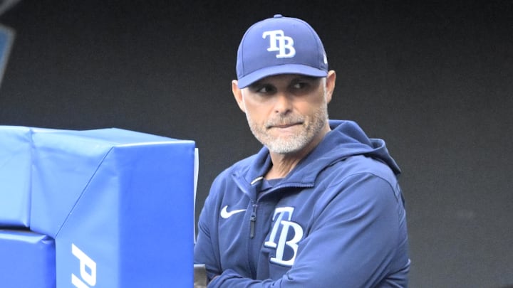 Aug 26, 2025; Cleveland, Ohio, USA; Tampa Bay Rays manager Kevin Cash (16) stands in the dugout in the first inning against the Cleveland Guardians at Progressive Field. Aug 26, 2025; Cleveland, Ohio, USA; Tampa Bay Rays manager Kevin Cash (16) stands in the dugout in the first inning against the Cleveland Guardians at Progressive Field.