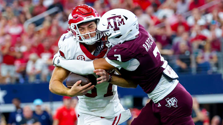 Sep 28, 2024; Arlington, Texas, USA; Arkansas Razorbacks punter Devin Bale (37) attempts a fake punt as Texas A&M Aggies defensive back Marcus Ratcliffe (3) makes the tackle during the second half at AT&T Stadium. Mandatory Credit: Kevin Jairaj-Imagn Images