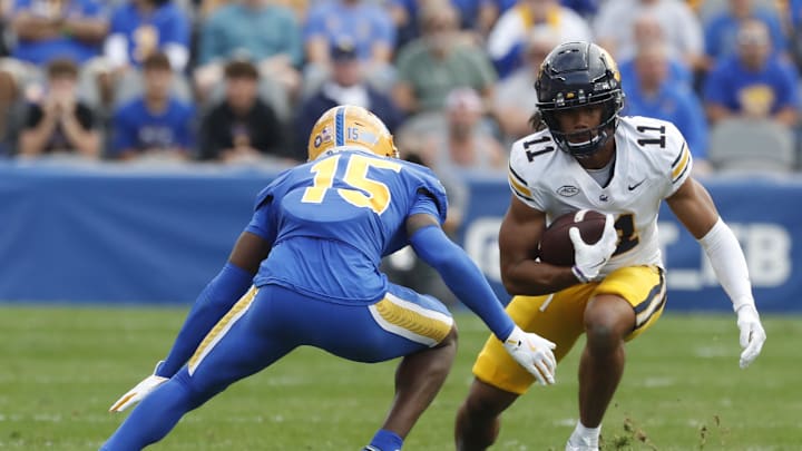 Oct 12, 2024; Pittsburgh, Pennsylvania, USA;  California Golden Bears wide receiver Mavin Anderson (11) runs after a catch as Pittsburgh Panthers defensive back Rashad Battle (15) defends during the first quarter at Acrisure Stadium. Mandatory Credit: Charles LeClaire-Imagn Images