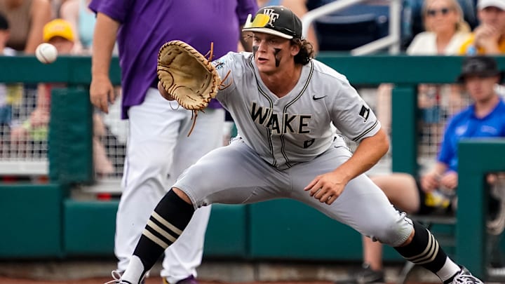 Jun 21, 2023; Omaha, NE, USA; Wake Forest Demon Deacons first baseman Nick Kurtz (8) gets an out during the first inning against the LSU Tigers at Charles Schwab Field Omaha. Mandatory Credit: Dylan Widger-Imagn Images