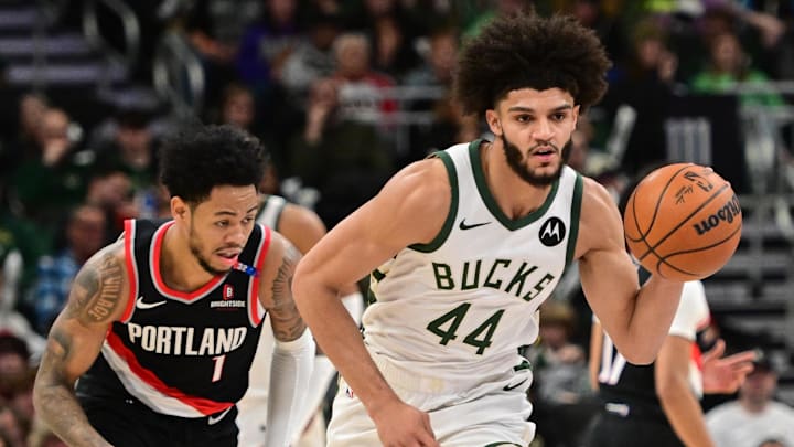 Jan 4, 2025; Milwaukee, Wisconsin, USA;  Milwaukee Bucks forward Andre Jackson Jr. (44) drives for the basket against Portland Trail Blazers guard Anfernee Simons (1) in the third quarter at Fiserv Forum. Mandatory Credit: Benny Sieu-Imagn Images