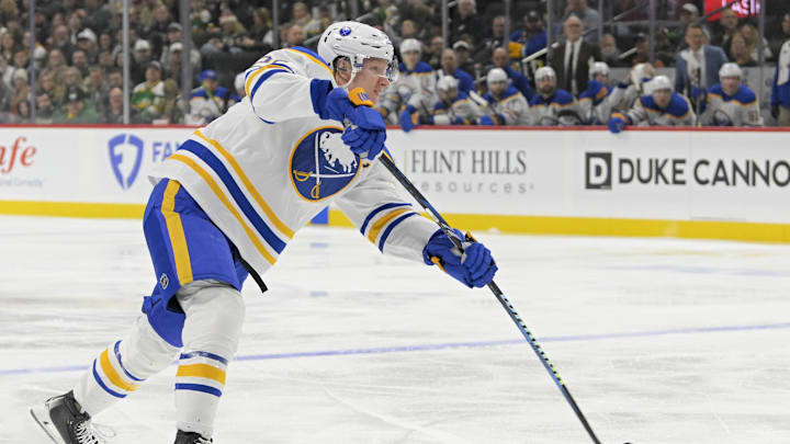Mar 22, 2025; Saint Paul, Minnesota, USA;  Buffalo Sabres defenseman Rasmus Dahlin (26) takes a shot on goal against the Minnesota Wild during the first period at Xcel Energy Center. Mandatory Credit: Nick Wosika-Imagn Images