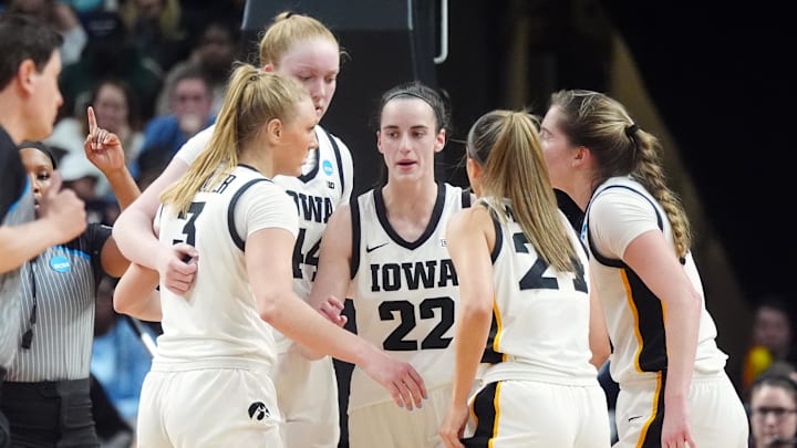 Apr 1, 2024; Albany, NY, USA; Iowa Hawkeyes guard Caitlin Clark (22) talks with teammates in a