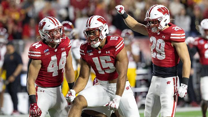 Oct 24, 2026; Madison, Wisconsin, USA;  Wisconsin Badgers outside linebacker Sebastian Cheeks (15) and linebacker Cooper Catalano (44) celebrate after tackling USC Trojans running back King Miller (8) as Wisconsin safety Matt Jung (29) joins the celebration during the first half at Camp Randall Stadium.  Mandatory Credit: Anthony Wahl-Imagn Images