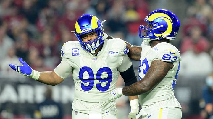 Dec 13, 2021; Glendale, Arizona, USA; Los Angeles Rams defensive end Aaron Donald (99) celebrates a sack with defensive tackle Marquise Copeland (93) against the Arizona Cardinals during the first half at State Farm Stadium. Mandatory Credit: Joe Camporeale-Imagn Images