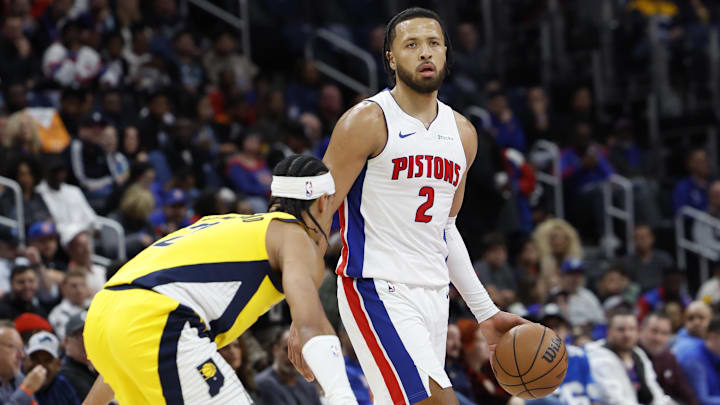 Oct 23, 2024; Detroit, Michigan, USA;  Detroit Pistons guard Cade Cunningham (2) dribbles defended by Indiana Pacers guard Andrew Nembhard (2) in the first half at Little Caesars Arena. Mandatory Credit: Rick Osentoski-Imagn Images