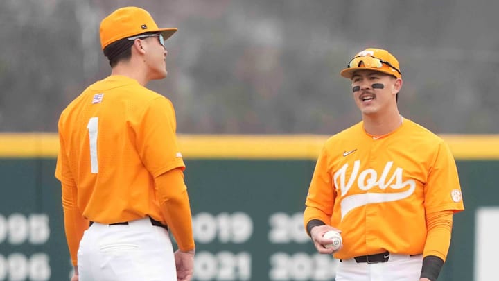 Tennessee outfielder Hunter Ensley (9) chats with Tennessee infielder Dean Curley in the outfield at a Tennessee baseball game against Samford, in Lindsey Nelson Stadium at University of Tennessee in Knoxville, Tenn., Saturday, Feb. 22, 2025.