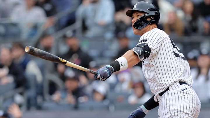 Mar 30, 2025; Bronx, New York, USA; New York Yankees right fielder Aaron Judge (99) watches his two run home run against the Milwaukee Brewers during the first inning at Yankee Stadium. Mandatory Credit: Brad Penner-Imagn Images