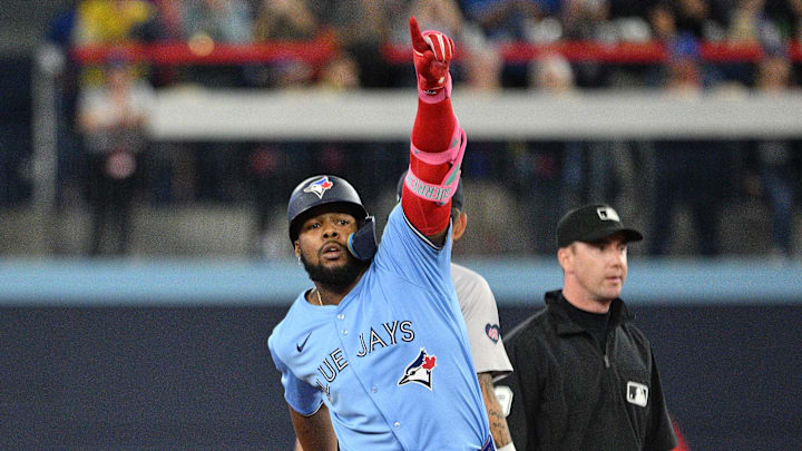 Sep 24, 2024; Toronto, Ontario, CAN; Toronto Blue Jays designated hitter Vladimir Guerrero Jr. (27) reacts after hitting a two run RBI double against the Boston Red Sox in the third inning at Rogers Centre. Mandatory Credit: Dan Hamilton-Imagn Images