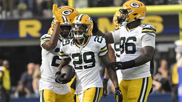 Green Bay Packers safety Xavier McKinney celebrates with teammates after intercepting a pass against the Rams on Sunday.