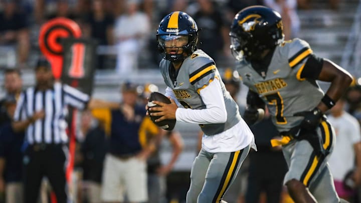 American Heritage Patriots quarterback Dia Bell (3) runs an option play during the first quarter of a game against the Naples Golden Eagles at Staver Field in Naples on Friday, Sept. 13, 2024.