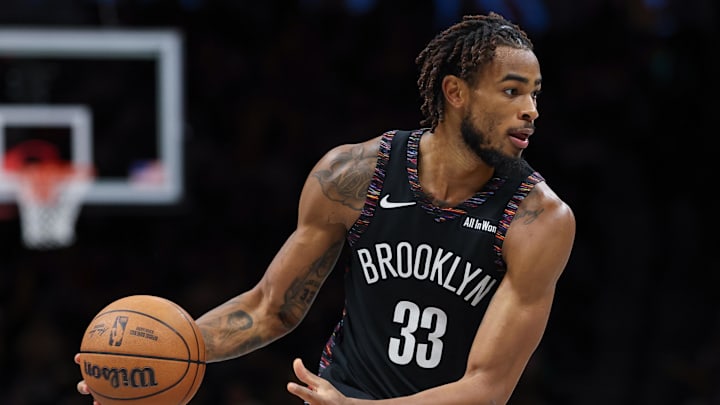 Nov 24, 2025; Brooklyn, New York, USA; Brooklyn Nets center Nic Claxton (33) dribbles during the second half against the New York Knicks at Barclays Center. Mandatory Credit: Vincent Carchietta-Imagn Images
