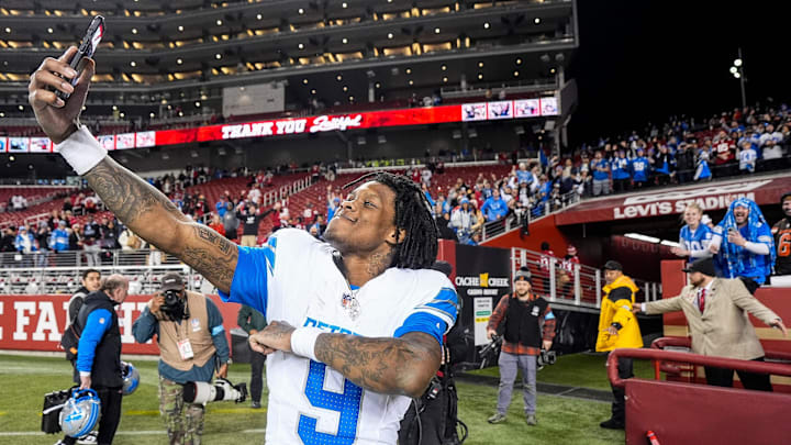 Detroit Lions wide receiver Jameson Williams (9) takes a selfie to celebrate 40-34 win over San Francisco 49ers as he exits the field at Levi's Stadium in Santa Clara, Calif. on Monday, Dec. 30, 2024.