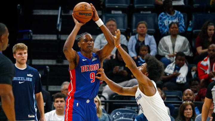 Oct 6, 2025; Memphis, Tennessee, USA; Detroit Pistons forward Ausar Thompson (9) handles the ball as Memphis Grizzlies forward Jaylen Wells (0) defends during the third quarter at FedExForum. Mandatory Credit: Petre Thomas-Imagn Images