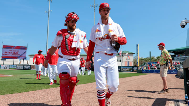 Feb 27, 2026; Jupiter, Florida, USA; St. Louis Cardinals starting pitcher Quinn Mathews (60) and catcher Pedro Pages (43) arrive to the dugout before theme against the New York Mets at Roger Dean Chevrolet Stadium. Mandatory Credit: Sam Navarro-Imagn Images