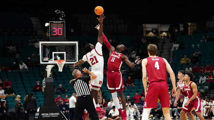 Nov 27, 2024; Las Vegas, Nevada, USA; Rutgers Scarlet Knights center Emmanuel Ogbole (21) wins the opening tip off over Alabama Crimson Tide center Clifford Omoruyi (11) during the first half at MGM Grand Garden Arena. Mandatory Credit: Stephen R. Sylvanie-Imagn Images Nov 27, 2024; Las Vegas, Nevada, USA; Rutgers Scarlet Knights center Emmanuel Ogbole (21) wins the opening tip off over Alabama Crimson Tide center Clifford Omoruyi (11) during the first half at MGM Grand Garden Arena. Mandatory Credit: Stephen R. Sylvanie-Imagn Images