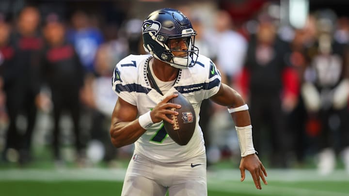 Oct 20, 2024; Atlanta, Georgia, USA; Seattle Seahawks quarterback Geno Smith (7) scrambles against the Atlanta Falcons in the third quarter at Mercedes-Benz Stadium. 