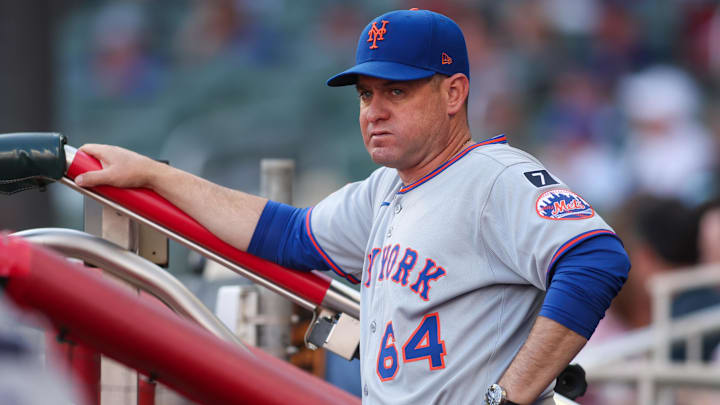 Jun 19, 2025; Atlanta, Georgia, USA; New York Mets manager Carlos Mendoza (64) in the dugout before a game against the Atlanta Braves at Truist Park. Mandatory Credit: Brett Davis-Imagn Images