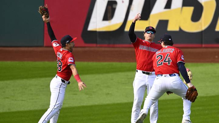Oct 15, 2026; Cleveland, Ohio, USA;  Cleveland Guardians outfielder Steven Kwan (38), outfielder Petey Halpin (0) and outfielder Chase DeLauter (24) celebrate a win against the Tampa Bay Rays in game three of the ALCS for the 2026 MLB Playoffs at Progressive Field.  Mandatory Credit: David Richard-Imagn Images