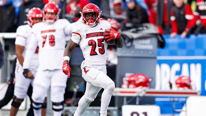 Nov 30, 2024; Lexington, Kentucky, USA; Louisville Cardinals running back Isaac Brown (25) runs the ball into the end zone for a touchdown during the fourth quarter against the Kentucky Wildcats at Kroger Field. Mandatory Credit: Jordan Prather-Imagn Images