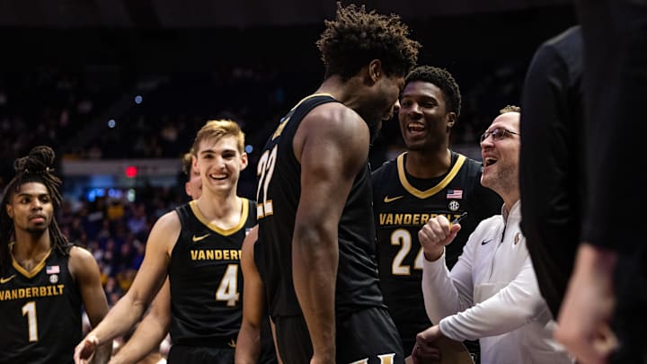 Jan 4, 2025; Baton Rouge, Louisiana, USA;  Vanderbilt Commodores forward Jaylen Carey (22) is congratulated by teammates on the bench after a basket against the LSU Tigers during the second half at Pete Maravich Assembly Center.