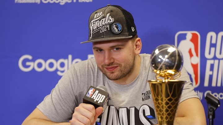 May 30, 2024; Minneapolis, Minnesota, USA; Dallas Mavericks guard Luka Doncic (77) at a press conference after winning the Western Conference Championship against the Minnesota Timberwolves in game five of the western conference finals for the 2024 NBA playoffs at Target Center. Mandatory Credit: Bruce Kluckhohn-Imagn Images May 30, 2024; Minneapolis, Minnesota, USA; Dallas Mavericks guard Luka Doncic (77) at a press conference after winning the Western Conference Championship against the Minnesota Timberwolves in game five of the western conference finals for the 2024 NBA playoffs at Target Center. Mandatory Credit: Bruce Kluckhohn-Imagn Images