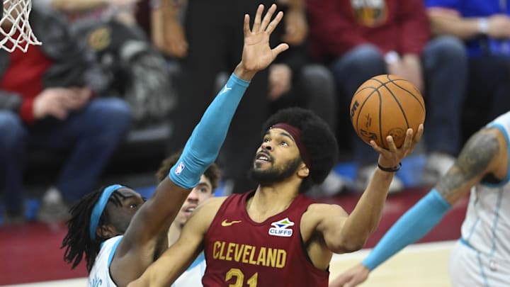 Jan 5, 2025; Cleveland, Ohio, USA; Cleveland Cavaliers center Jarrett Allen (31) shoots beside Charlotte Hornets center Mark Williams (5) in the fourth quarter at Rocket Mortgage FieldHouse. Mandatory Credit: David Richard-Imagn Images