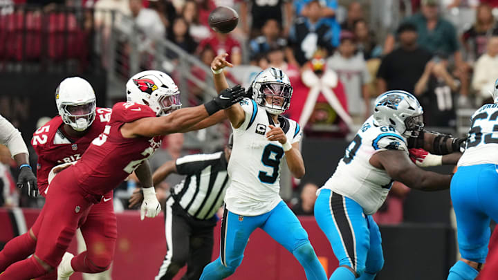 Arizona Cardinals linebacker Zaven Collins (25) hits Carolina Panthers quarterback Bryce Young (9) as he throws the ball at State Farm Stadium on Sept 14, 2025. Arizona Cardinals linebacker Zaven Collins (25) hits Carolina Panthers quarterback Bryce Young (9) as he throws the ball at State Farm Stadium on Sept 14, 2025.