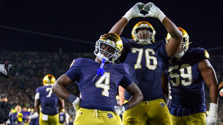 Jeremiyah Love #4 of the University of Notre Dame celebrates his touchdown with teammate Guerby Lambert #76 during a game between University of Southern California and University of Notre Dame at Notre Dame Stadium on October 18, 2025 in South Bend, Indiana. Jeremiyah Love #4 of the University of Notre Dame celebrates his touchdown with teammate Guerby Lambert #76 during a game between University of Southern California and University of Notre Dame at Notre Dame Stadium on October 18, 2025 in South Bend, Indiana.