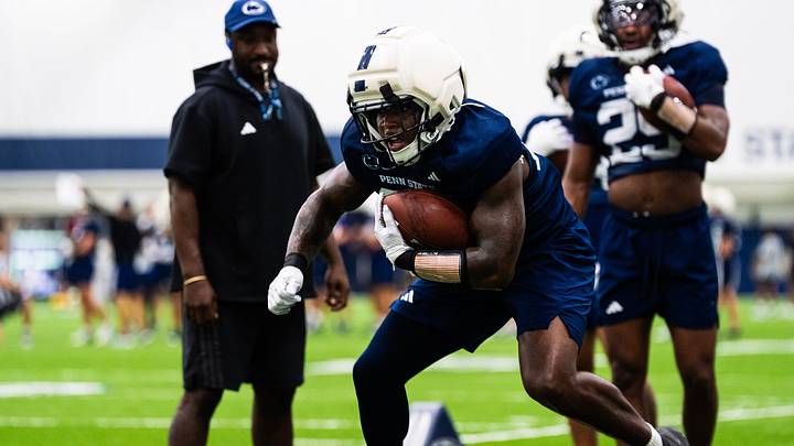 Penn State Nittany Lions running back Cam Wallace runs through a drill during a practice session inside Holuba Hall. Penn State Nittany Lions running back Cam Wallace runs through a drill during a practice session inside Holuba Hall.