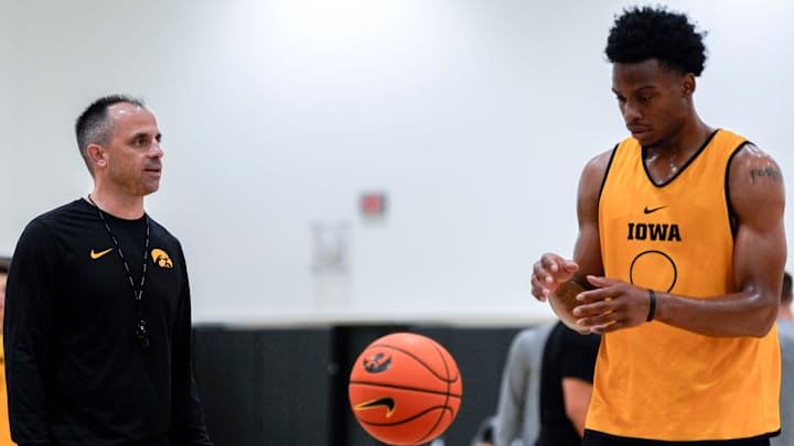 Iowa men’s basketball head coach Ben McCollum talks to Tavion Banks (6) as he prepares to shoot a free throw during practice June 19, 2025 at Carver-Hawkeye Arena in Iowa City, Iowa.