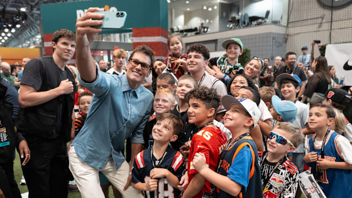 Tom Brady takes a selfie with the crowd at the 2025 Fanatics Fest event. Tom Brady takes a selfie with the crowd at the 2025 Fanatics Fest event.