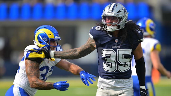 Dallas Cowboys linebacker Marist Liufau grabs a hold of Los Angeles Rams running back Cody Schrader. Dallas Cowboys linebacker Marist Liufau grabs a hold of Los Angeles Rams running back Cody Schrader.