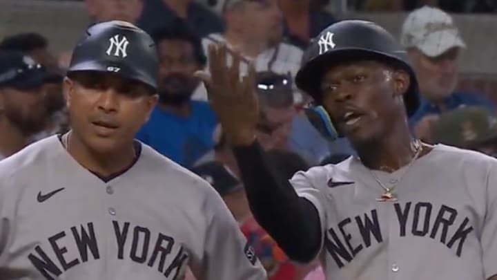 Jazz Chisholm Jr. (right) and Braves coach Eddie Perez exchanged some heated words during Saturday's game. 