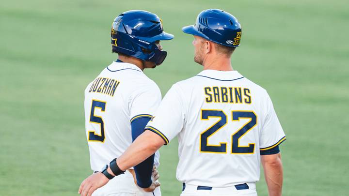 West Virginia UT Armani Guzman (5) and head coach Steve Sabins (22). West Virginia UT Armani Guzman (5) and head coach Steve Sabins (22).