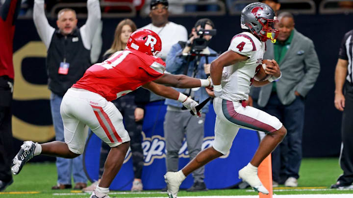 Destrehan quarterback Jai Eugene (4) scores a touchdown against Ruston.