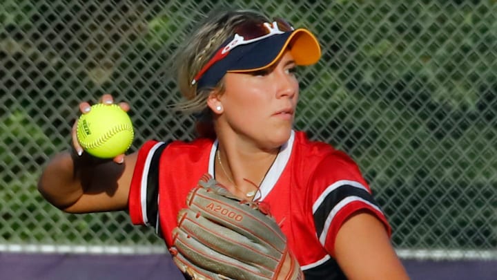 Frazier's Grace Vaughn, an East Tennessee State commit, looks to throw the ball to first base during the Western Pennsylvania Softball All-Star game Tuesday night at Plum High School.