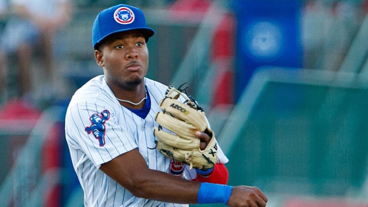 South Bend Cubs infielder Jefferson Rojas flies in the air as he makes a throw to first in the fifth inning of a minor league baseball game against the Lake County Captains at Four Winds Field on Friday, June 21, 2024, in South Bend.