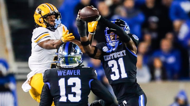 Kentucky Wildcats defensive back Maxwell Hairston (31) intercepts a pass intended for Missouri Tigers wide receiver Luther Burden III at Kroger Field Saturday on Oct. 14, 2023. The interception helped the Wildcats with a touchdown drive. Kentucky Wildcats defensive back Maxwell Hairston (31) intercepts a pass intended for Missouri Tigers wide receiver Luther Burden III at Kroger Field Saturday on Oct. 14, 2023. The interception helped the Wildcats with a touchdown drive.