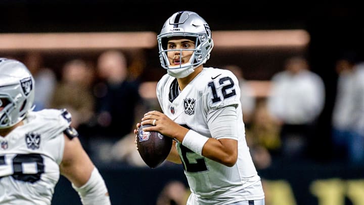 Dec 29, 2024; New Orleans, Louisiana, USA;  Las Vegas Raiders quarterback Aidan O'Connell (12) looks on against the New Orleans Saints during the second half at Caesars Superdome. Mandatory Credit: Stephen Lew-Imagn Images