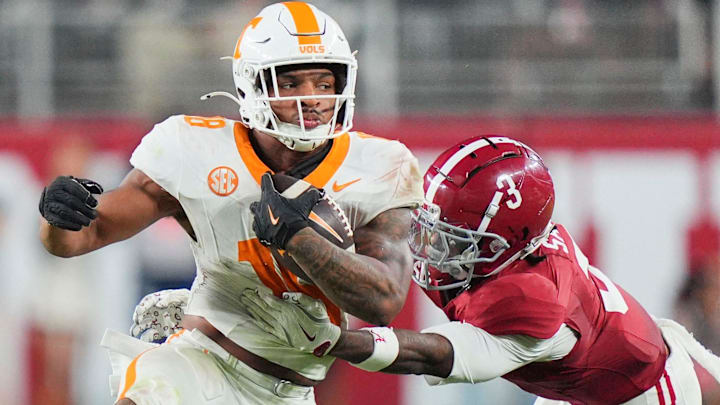 Tennessee linebacker Edwin Spillman (13) is grabbed by Alabama defensive back Keon Sabb (3) during a college football game at Bryant-Denny Stadium in Tuscaloosa, Ala., on Oct. 18, 2025. Tennessee linebacker Edwin Spillman (13) is grabbed by Alabama defensive back Keon Sabb (3) during a college football game at Bryant-Denny Stadium in Tuscaloosa, Ala., on Oct. 18, 2025.