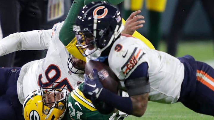 Green Bay Packers quarterback Jordan Love (10) looks on as Chicago Bears safety Jaquan Brisker (9) recovers his fumble in the third quarter during their football game Sunday, January 7, 2024, in Green Bay, Wisconsin.