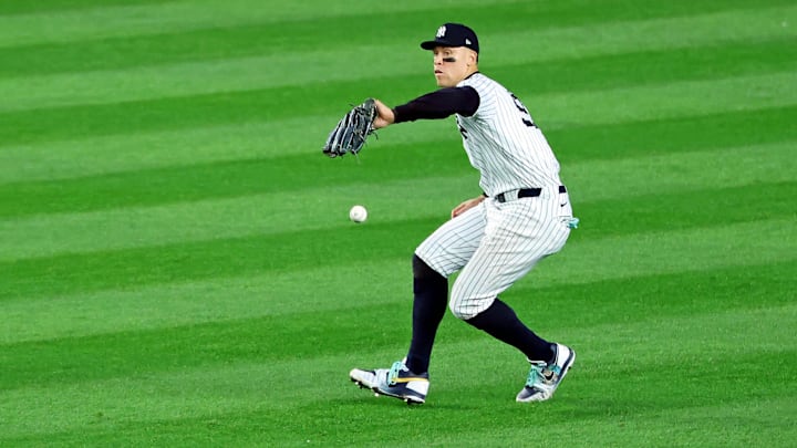 Oct 30, 2024; Bronx, New York, USA;  New York Yankees outfielder Aaron Judge (99) drops a fly ball during the fifth inning against the Los Angeles Dodgers during game five of the 2024 MLB World Series at Yankee Stadium. Mandatory Credit: James Lang-Imagn Images